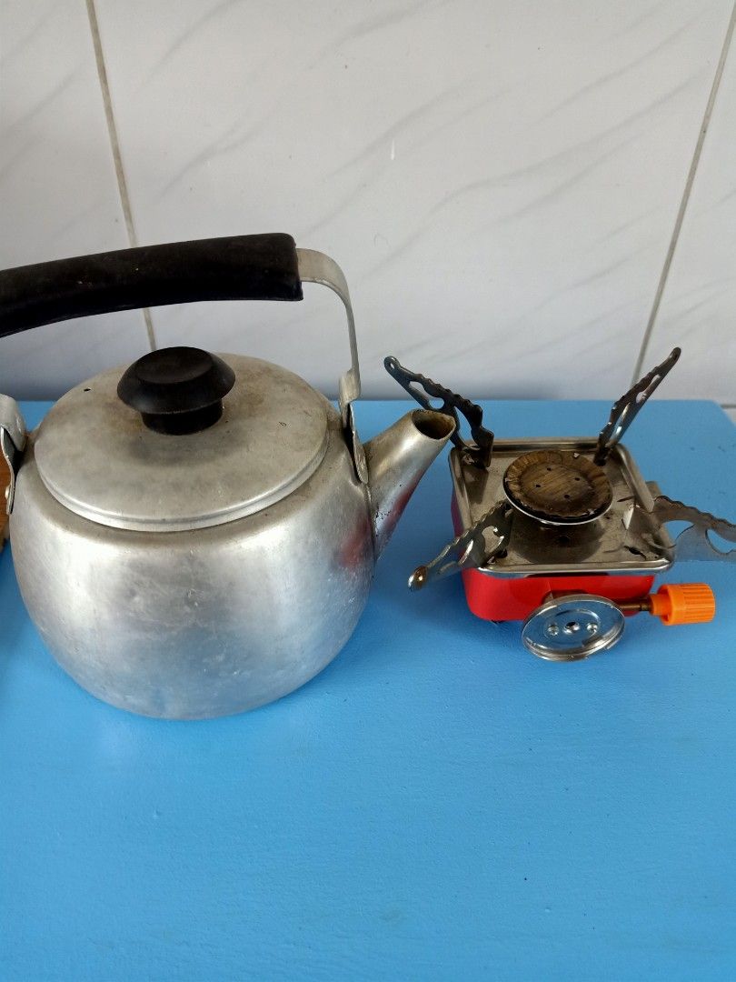 Portable stove and small kettle (Category: Hiking & Camping) located in Las Pinas. Submitted by quick_deals_great_finds2 (Listing ID 1235166761, Image 1). Description: good working condition.
