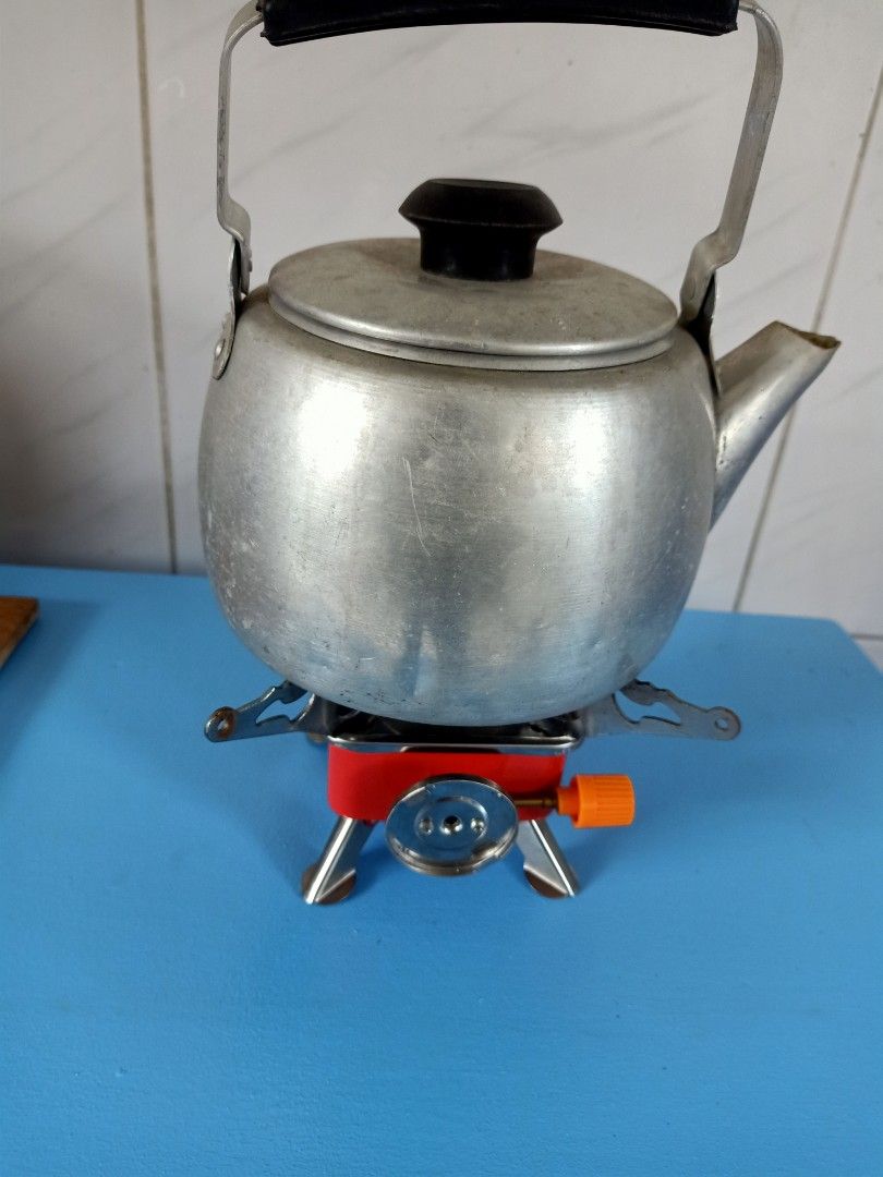Portable stove and small kettle (Category: Hiking & Camping) located in Las Pinas. Submitted by quick_deals_great_finds2 (Listing ID 1235166761, Image 2). Description: good working condition.