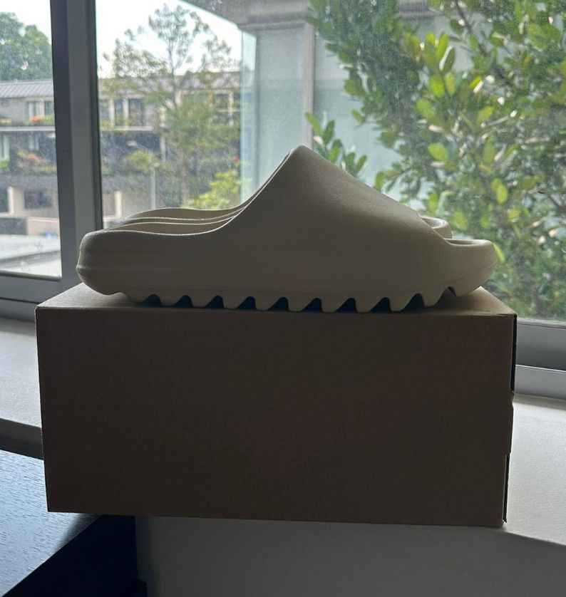 Yeezy Slide size 10 from stockX, Men's Fashion, Footwear, Flipflops and  Slides on Carousell