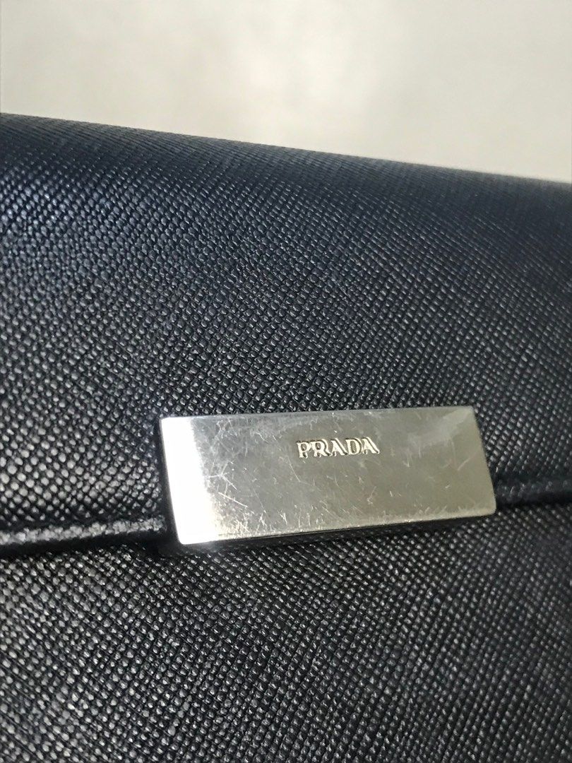 Black Prada Wallet (Category: Luxury Bags & Wallets) located in Paranaque City. Submitted by eller_2 (Listing ID 1238548457, Image 2). Description: Authentic Prada wallet for men and women Color:Black and violet inside Condition:Great (Buyer will shoulder the shipping fee).