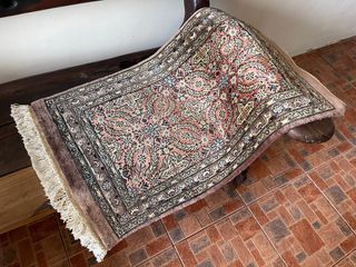 Fine wool rug / carpet, vintage camel saddle and bronze sculpture
