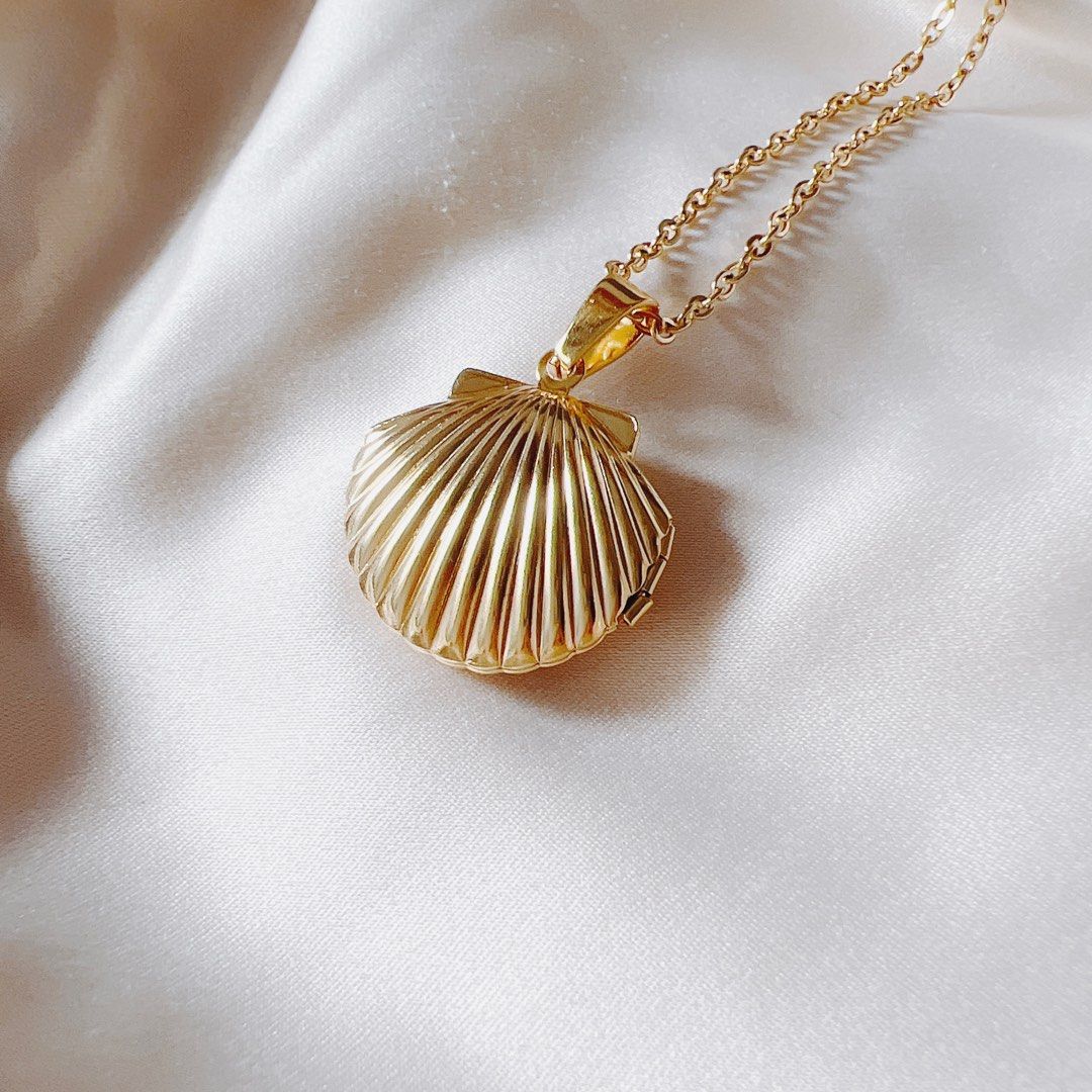 Gold shell pendant on sale