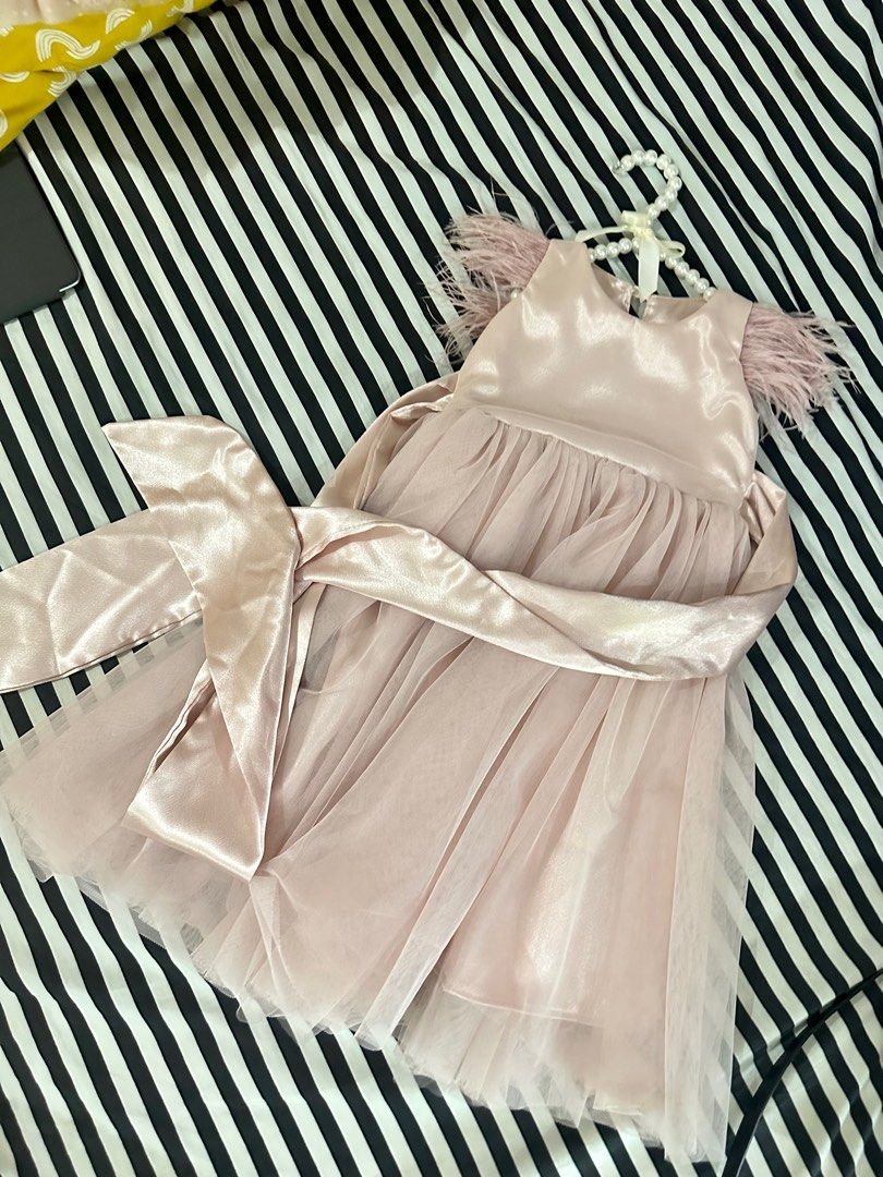 Spinkie Sophia pale pink (Category: Babies & Kids Fashion) located in Taguig. Submitted by puffpiece (Listing ID 1238466847, Image 3). Description: Selling spinkie 12-18m Used once, flamingo themed birthday Feathers were worn out due to storage 8/10 looks nice though Orig price 2850 Last price posted, sf shouldered by buyer.
