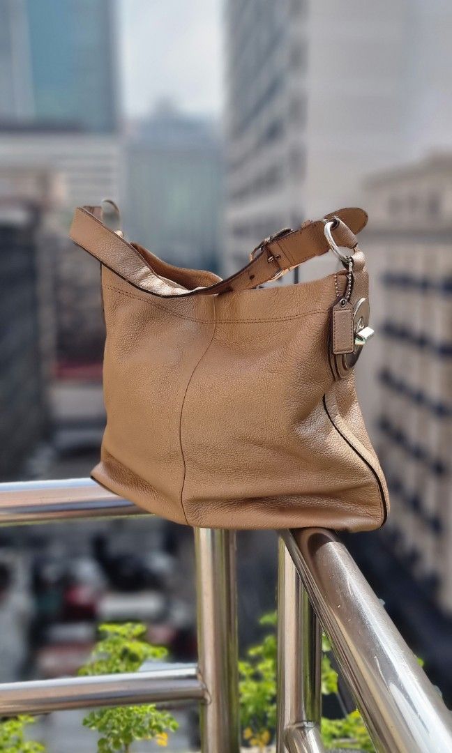 Coach Penelope in Pebble Leather gold Authentic (Category: Luxury Bags & Wallets) located in Makati City. Submitted by lilyignacio81 (Listing ID 1238617445, Image 3). Description: Coach Penelope Turn Lock Pebble Leather Gold Hobo Shoulder Bag, is a stylish and luxurious accessory that combines functionality with exquisite design. Crafted with high-quality pebble leather, this bag is a true fashion statement. The Coach Penelope Hobo Shoulder Bag f
