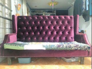 Purple velvet tufted sofa