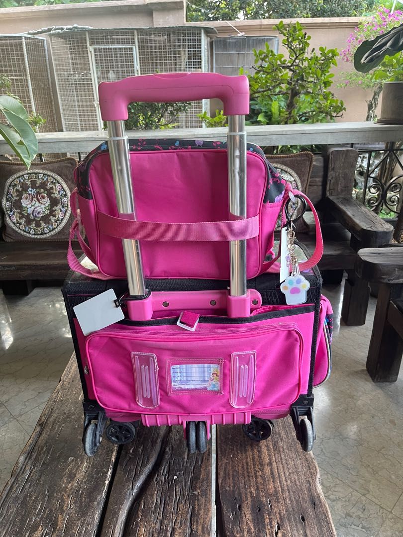 Disney Trolley School Bag (Category: Strollers) located in Batangas. Submitted by thrifttinstyle (Listing ID 1238880826, Image 3). Description: Complete with snack bag and cover. Only one cracked wheel but still works well. Can do meet up..