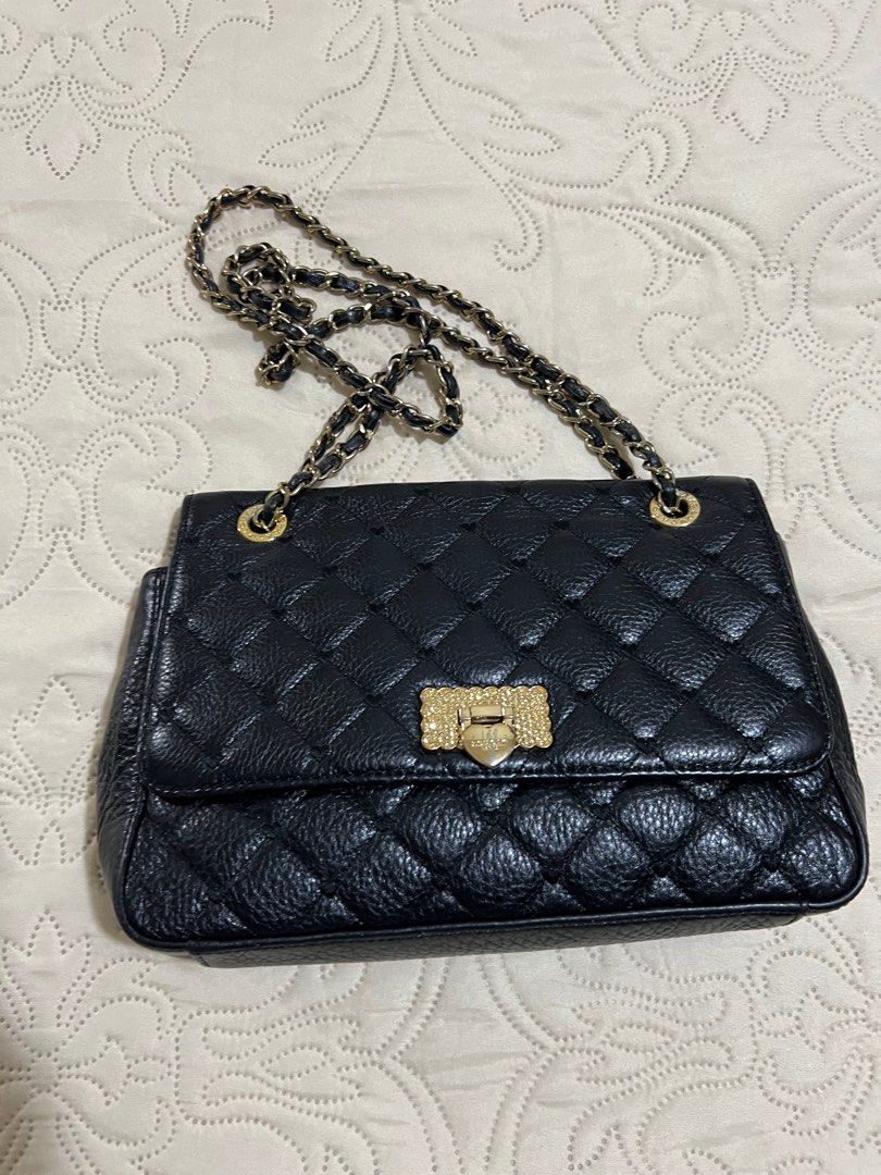 Love Cat shoulder and body bag (Category: Shoulder Bags) located in Pasig City. Submitted by eclacson (Listing ID 1238910784, Image 2). Description: Lov Cat shoulder and body bag Well used bit still presentable small size.