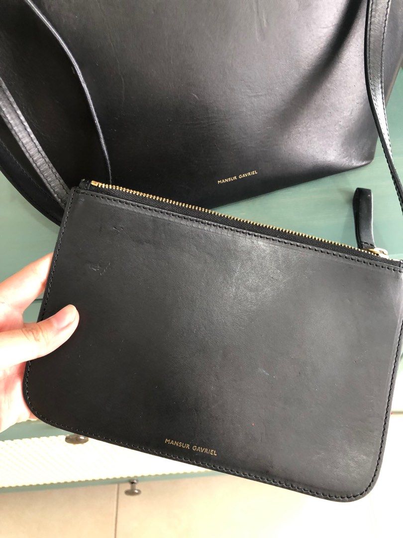 Mansur Gavriel Bucket Bag (Black) (Category: Luxury Bags & Wallets) located in Taguig. Submitted by user51982 (Listing ID 1238807862, Image 3). Description: RFS: decluttering my closet Width : 9 in / 23 cm Height : 12.2 in / 31 cm Depth : 5.9 in / 15 cm Crossbody Drop: Max 21.8 in / 55.5 cm - Min 18.5 in / 47 cm Composition: 100% Italian Vegetable Tanned Leather Made in Italy.