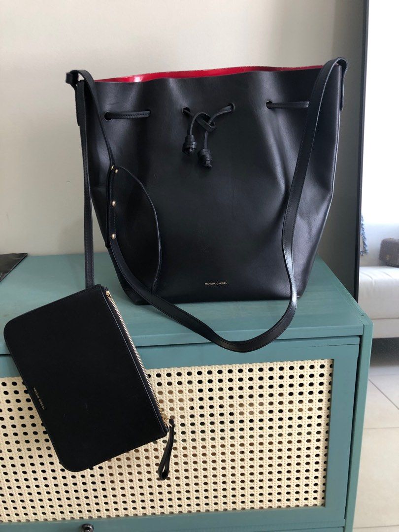 Mansur Gavriel Bucket Bag (Black) (Category: Luxury Bags & Wallets) located in Taguig. Submitted by user51982 (Listing ID 1238807862, Image 1). Description: RFS: decluttering my closet Width : 9 in / 23 cm Height : 12.2 in / 31 cm Depth : 5.9 in / 15 cm Crossbody Drop: Max 21.8 in / 55.5 cm - Min 18.5 in / 47 cm Composition: 100% Italian Vegetable Tanned Leather Made in Italy.