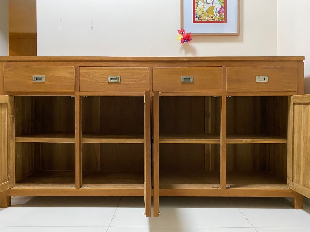 Solid teak buffet sideboard (Category: Shelves, Cabinets & Racks) located in Singapore. Submitted by fixerfund (Listing ID 1238796278, Image 2). Description: Not negotiable. 200x100x50cm, solid teak. Very heavy. Some surface marks. Not for fussy. Delivery can be arranged. .