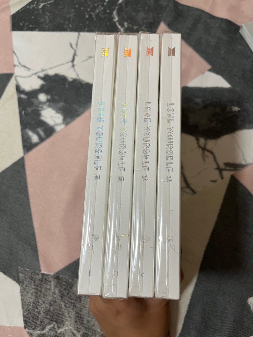 [BTS Album] LOVE YOUSELF HER (Category: CDs & DVDs) located in Apalit. Submitted by jamelabi (Listing ID 1239207062, Image 2). Description: BTS LOVE YOUSELF HER L - available O - SOLD V - available E - available Price: - 300 each version ✨ Complete inclusions except random PC ✨ Each album has a plactic cover. Condition is like new. Opened just to get the ramdom PC. .