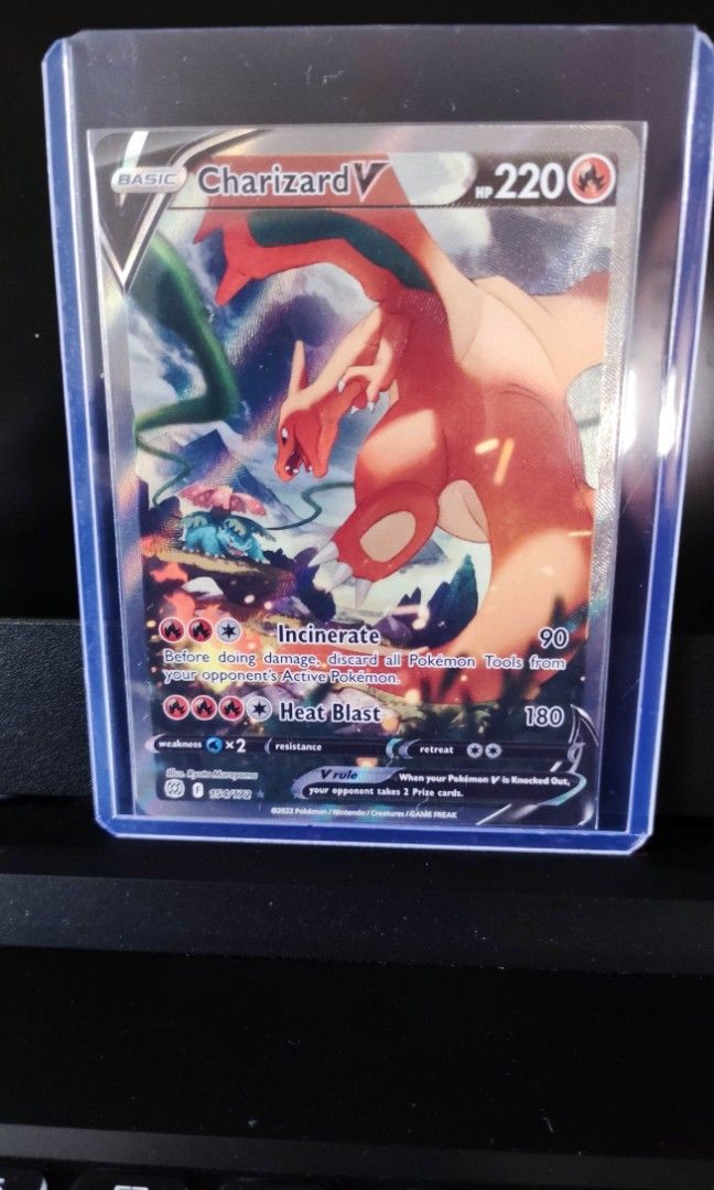 Charizard V (Category: Vintage Collectibles) located in Singapore. Submitted by busyfish (Listing ID 1239201416, Image 1). Description: Want to clear all my Pokémon cards. Selling cheaper than market rate. Mailing + $2.