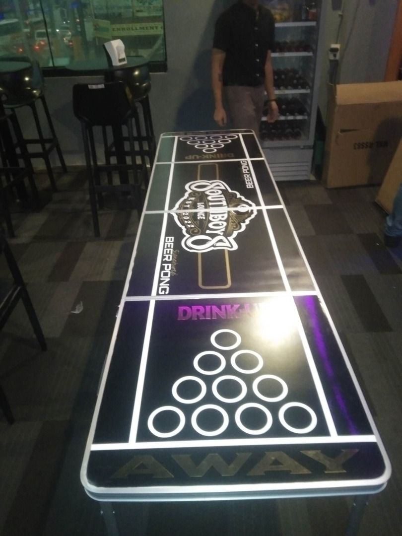 Customized Beer Pong Table (Category: Other Sports Equipment and Supplies) located in Manila. Submitted by dreamzsportssuppliestrading4 (Listing ID 1239211175, Image 3). Description: Customized Beer Pong Table Beer pong, also known as Beirut, is a drinking game in which players throw a ping pong ball across a table with the intent of landing the ball in a cup of beer on the other end. The game typically consists of opposing teams of two or more p