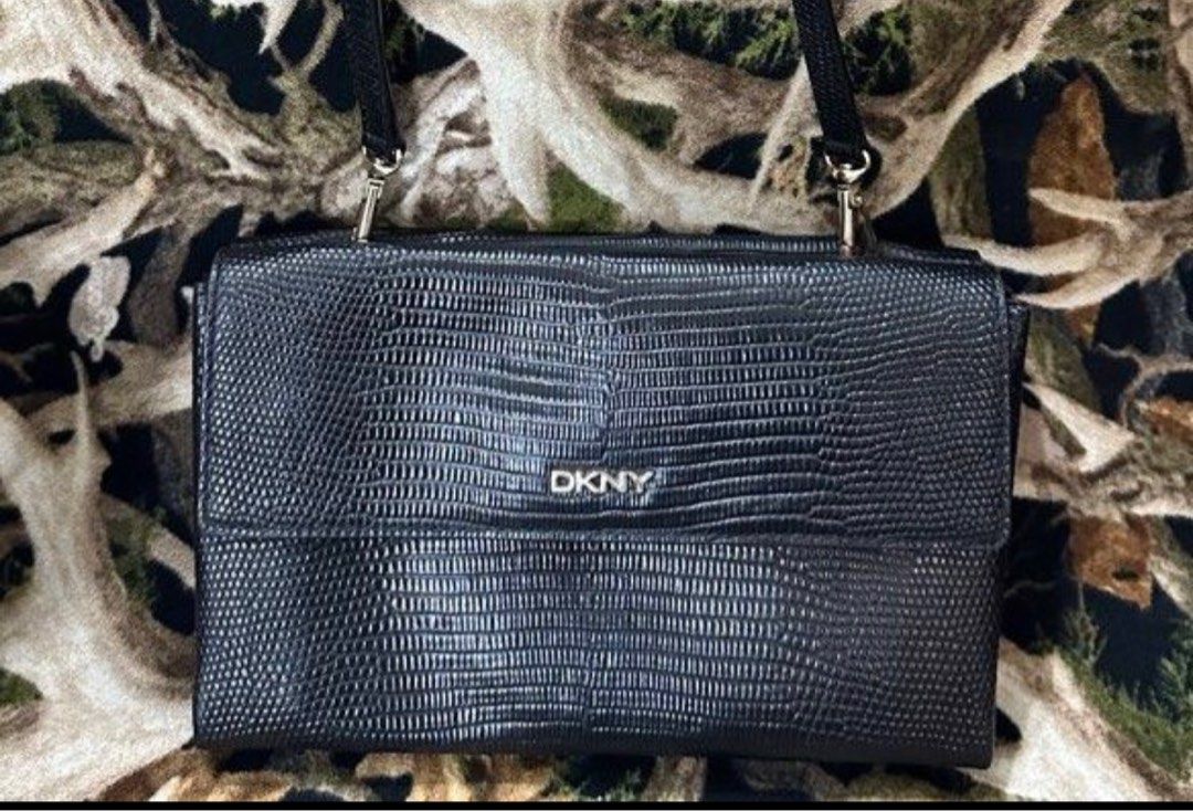 DKNY Wallet Sling Bag (Category: Luxury Bags & Wallets) located in Manila. Submitted by shopaholic_gurl (Listing ID 1237885967, Image 1). Description: Like new item Dual flap compartment Internal zipped pocket Fits monile phone and Basic essentials Add shipping fee Sold as is.