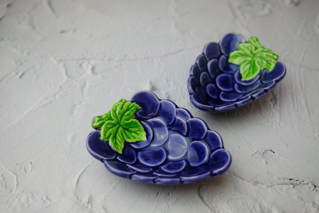 Grapes ceramic dipping dish / trinket dish (Category: Accessory Holder, Box & Organizers) located in Paranaque City. Submitted by bfria (Listing ID 1239194169, Image 2). Description: Dimensions - L: 4.4” x W: 3” x H: 1” Note: 1 dish is flawed 👓 PLEASE READ 👓 📌 Item is secondhand unless stated New 📌 Color may vary due to lighting 📌 No meet-ups 📌 NO RUSH shipping 📌 The buyer will shoulder the shipping fee. 📌 Kindly manage your expectations 