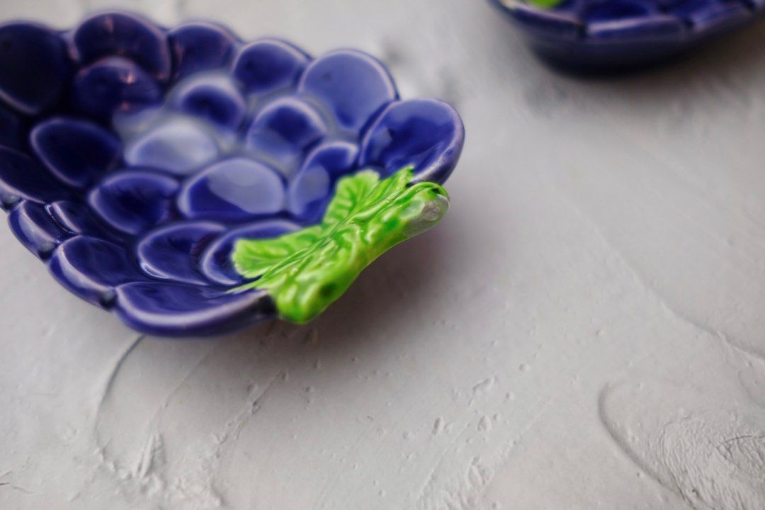 Grapes ceramic dipping dish / trinket dish (Category: Accessory Holder, Box & Organizers) located in Paranaque City. Submitted by bfria (Listing ID 1239194169, Image 3). Description: Dimensions - L: 4.4” x W: 3” x H: 1” Note: 1 dish is flawed 👓 PLEASE READ 👓 📌 Item is secondhand unless stated New 📌 Color may vary due to lighting 📌 No meet-ups 📌 NO RUSH shipping 📌 The buyer will shoulder the shipping fee. 📌 Kindly manage your expectations 