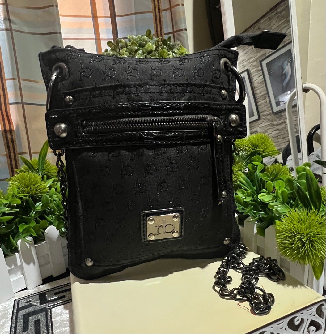 ROCCO BAROCCO (Category: Purses & Pouches) located in Marikina City. Submitted by landertroy (Listing ID 1239326213, Image 1). Description: rocco barocco black logo imprint nylon in black gun metal hardware, mini mobile/tablet sling/crosbody bag for men and women.
