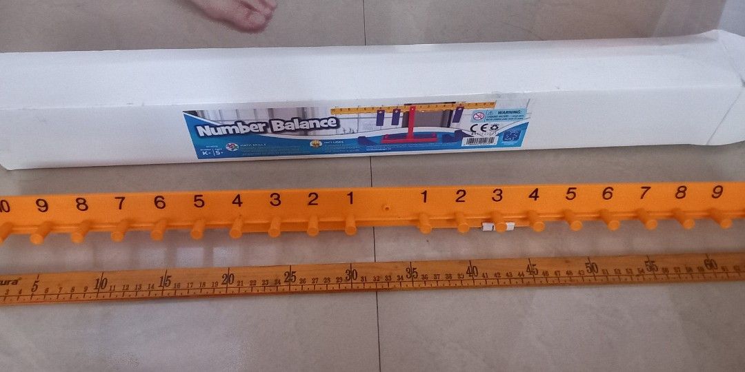 Educational Insights Big Number Balance for Learning Math (Category: Educational & Learning Toys) located in Caloocan City. Submitted by colorsandcrafts (Listing ID 1239340880, Image 2). Description: PRICE AS POSTED Dimensions: L 65cm, H 24 cm W 7.5 cm Weights weigh 10 g each. 20 weights included in the set. You can hang the weights on front and back of the balance. Complete parts. With manual and box. Imported Payment can be made thru gcash Ship
