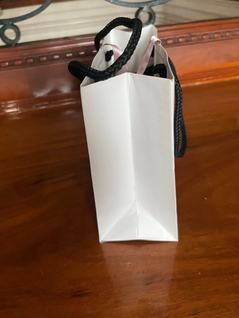 PANDORA PAPER BAG (Category: Luxury Bags & Wallets) located in Makati City. Submitted by cashfrancefashioncosmetics_ph (Listing ID 1239328999, Image 3). Description: PANDORA PAPER BAG WITH RIBBON SIZE IS 6 1/2INCHES .