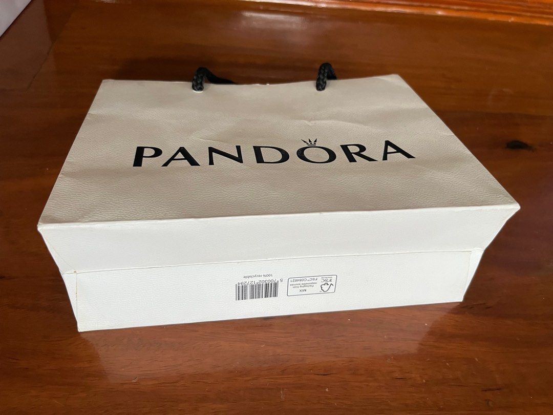 PANDORA PAPER BAG (Category: Luxury Bags & Wallets) located in Makati City. Submitted by cashfrancefashioncosmetics_ph (Listing ID 1239328999, Image 2). Description: PANDORA PAPER BAG WITH RIBBON SIZE IS 6 1/2INCHES .
