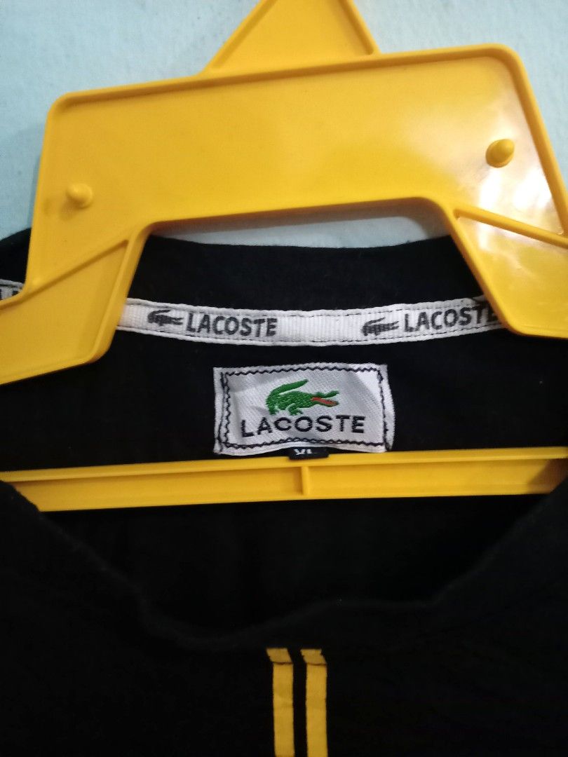 Black and online yellow lacoste shirt