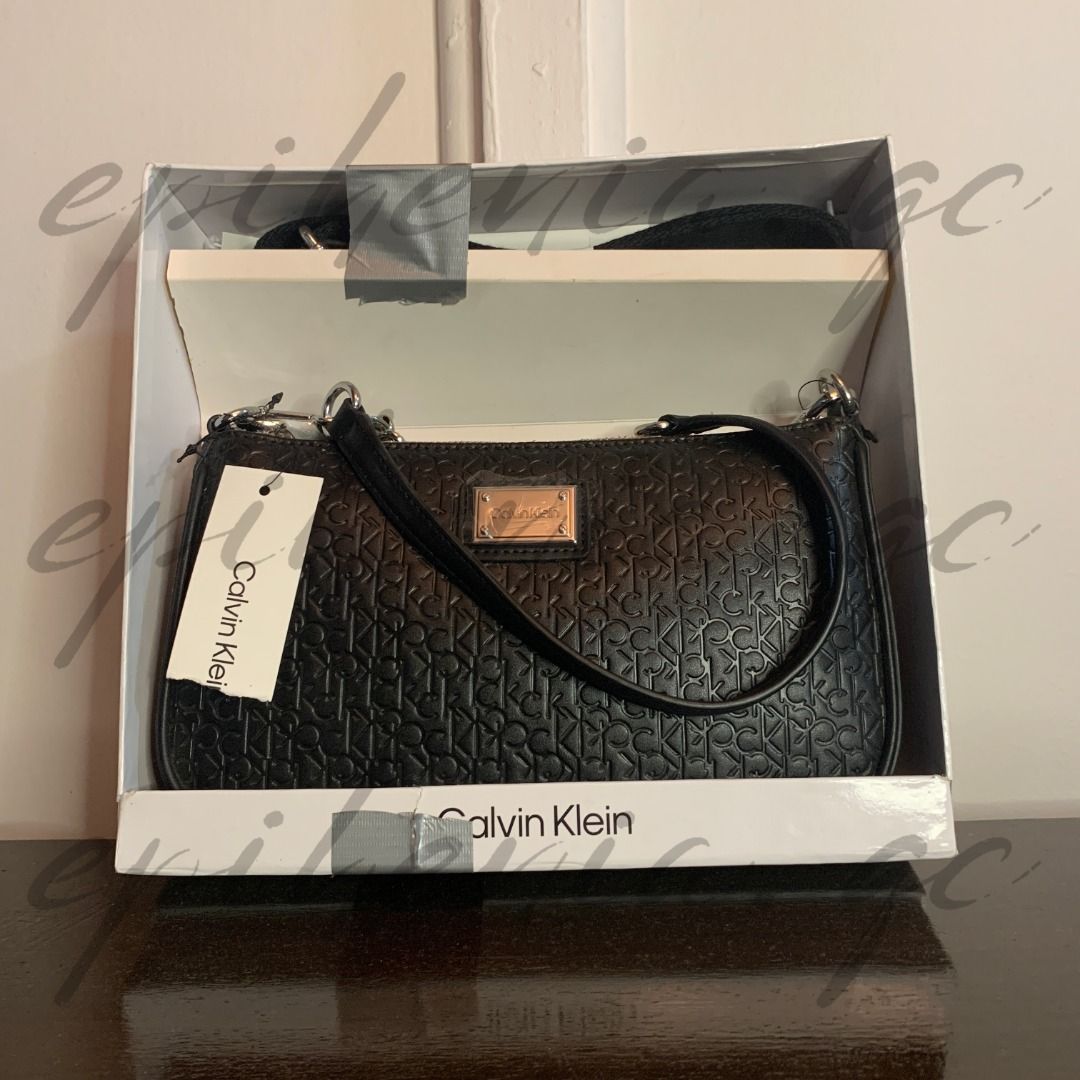 Calvin Klein phone crossbody, Luxury, Bags & Wallets on Carousell