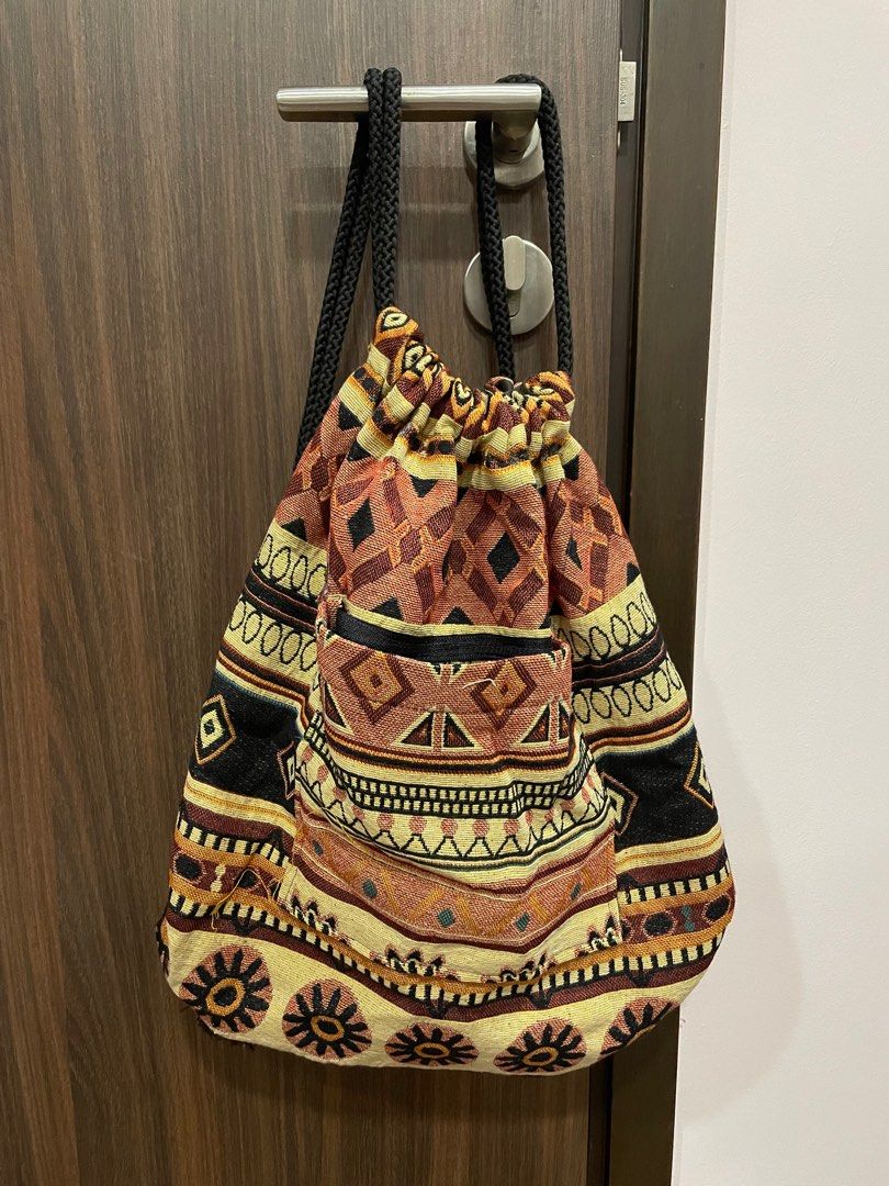 Drawstring Bag (Category: Backpacks) located in Singapore. Submitted by wonsfoelipa (Listing ID 1239699634, Image 1). Description: From Thailand! Brand new, very roomy drawstring bag! Fits many items! Has a pocket at the front.