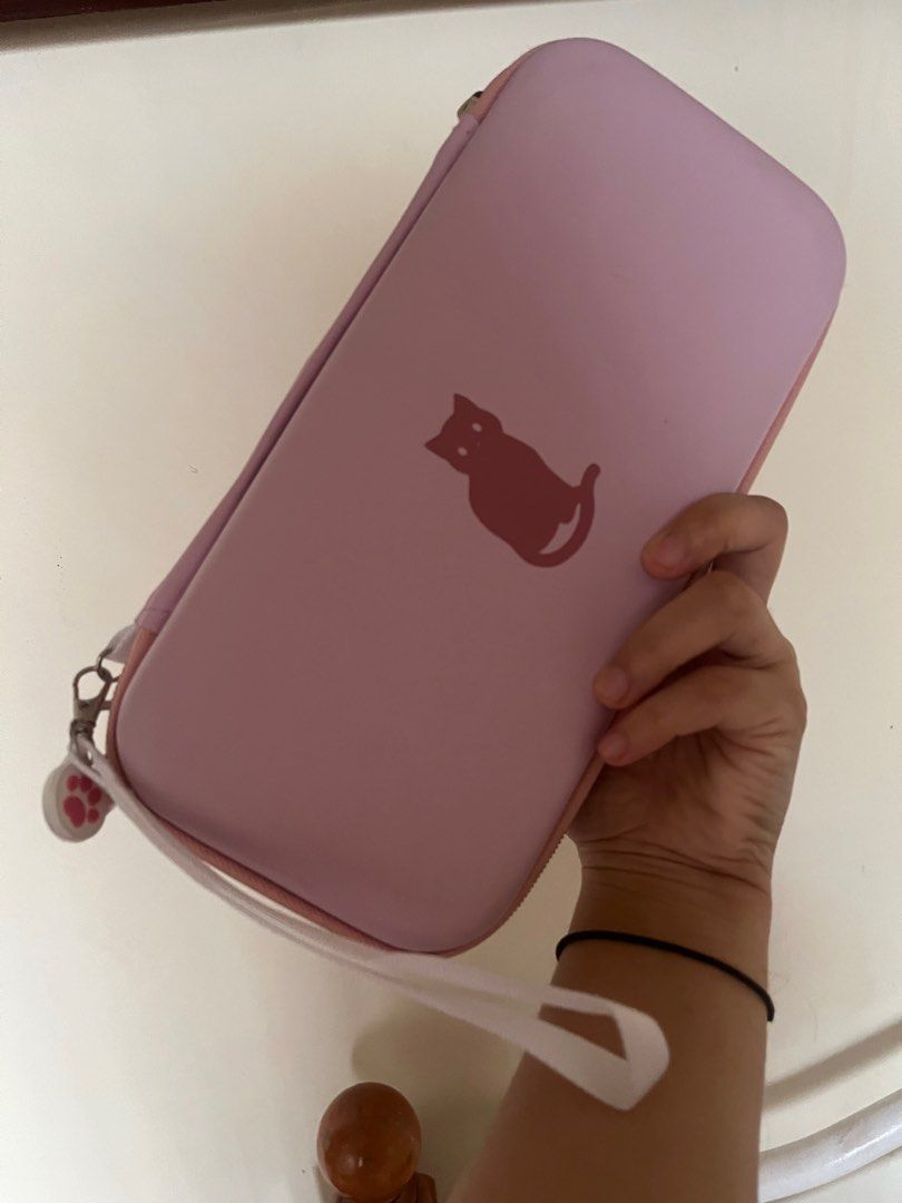 Geekshare Nintendo Switch bag with hard case protector (Category: Nintendo) located in Las Pinas. Submitted by ricaaveve (Listing ID 1239707298, Image 2). Description: Selling my pre loved almost new switch bag and hard case. Please see pictures for your reference. RFS: already sold my switch 🗒️ only sold as a bundle Message me for sure buyers! 😊.