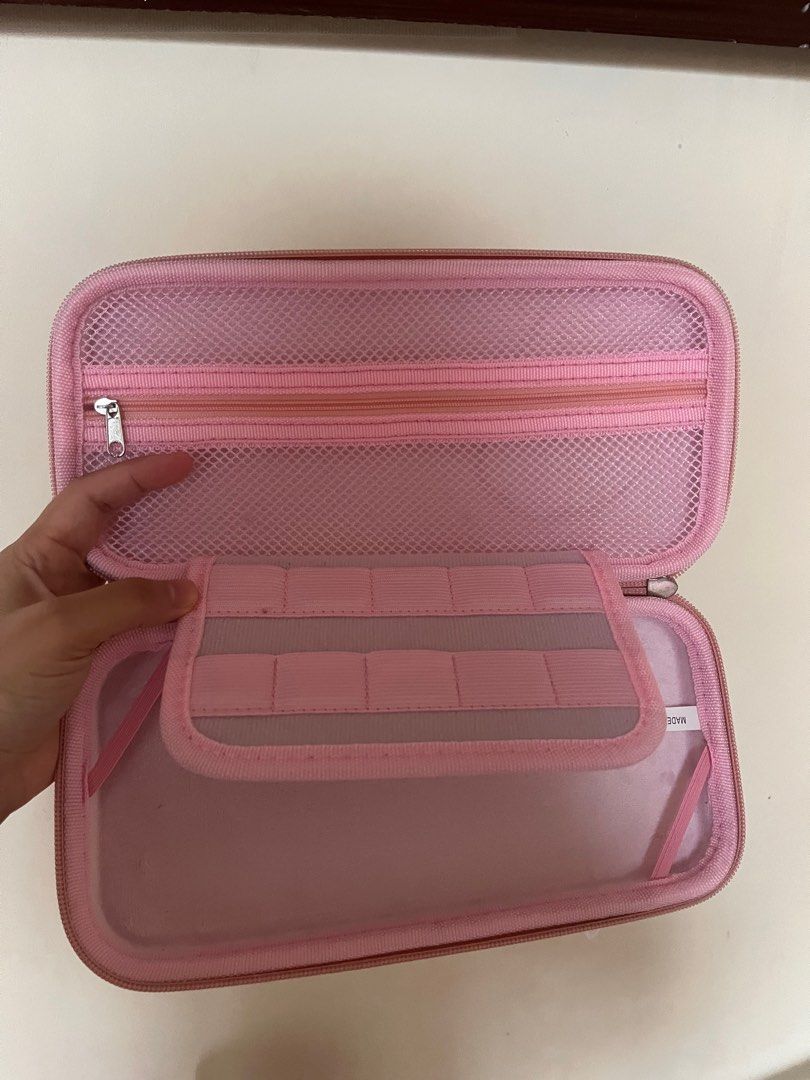 Geekshare Nintendo Switch bag with hard case protector (Category: Nintendo) located in Las Pinas. Submitted by ricaaveve (Listing ID 1239707298, Image 3). Description: Selling my pre loved almost new switch bag and hard case. Please see pictures for your reference. RFS: already sold my switch 🗒️ only sold as a bundle Message me for sure buyers! 😊.
