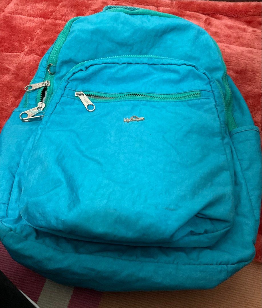 Kipling backpack (Blue-greenish color) (Category: Backpacks) located in Bacoor. Submitted by iamannie_12 (Listing ID 1239699199, Image 3). Description: • with laptop sleeve • with tumbler holder • super useful nito sa akin kasi it’s waterproof ++ very lightweight pa siya (lagi ko siyang gamit whenever im nagcocommute) • negotiable❗️ • in good condition .