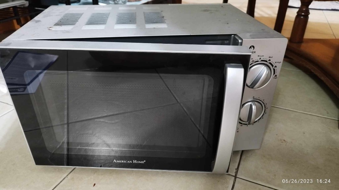 Microwave with rusted bottom on Carousell