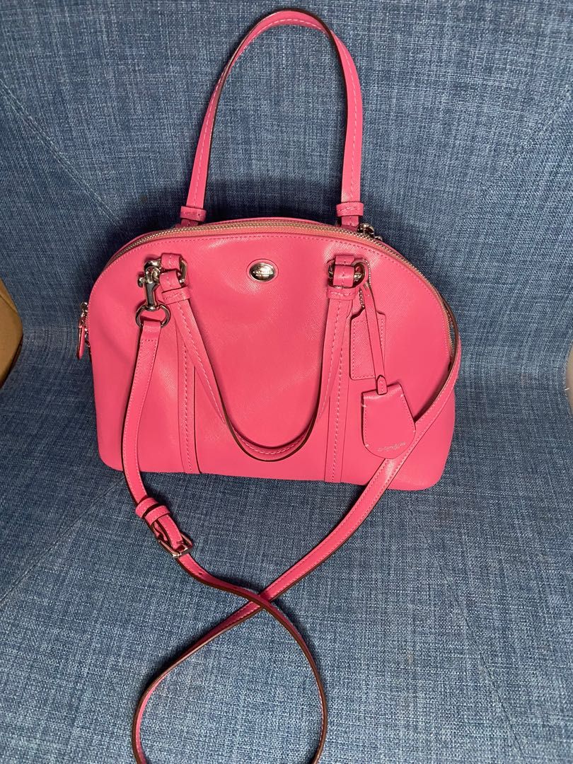 Coach (Category: Luxury Bags & Wallets) located in Caloocan City. Submitted by toothfairy09 (Listing ID 1239843353, Image 3). Description: This is a 2014 Peyton Cora Dome satchel from Coach. It features a strawberry pink colored Saffiano leather exterior w/ an external pocket on the back, silver hardware & original hangtag leather hangtag. Has dual zipper closure & top handles that have a 6" drop. Crossbody strap is included.Interior has beige fa
