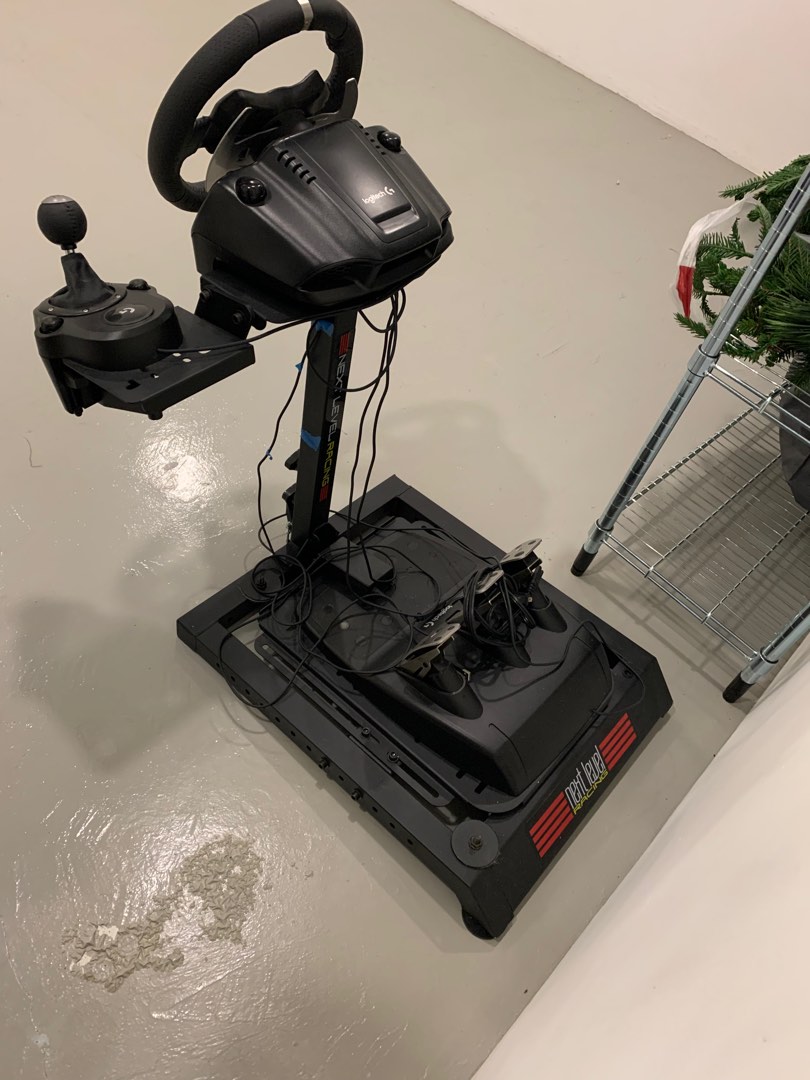 Logitech steering wheel, gearshifter, and pedal set attached to a NextLevel stand, Video