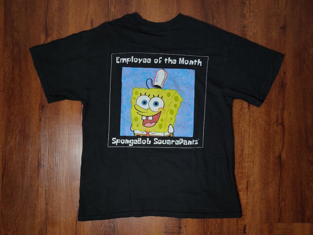 Suavely-dressed Man With A Playful Spongebob Squarepants T-shirt In A