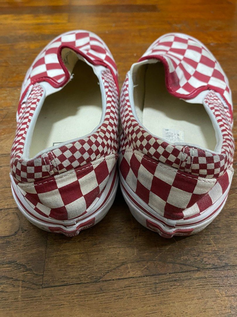 Red and white checkered vans slip on top