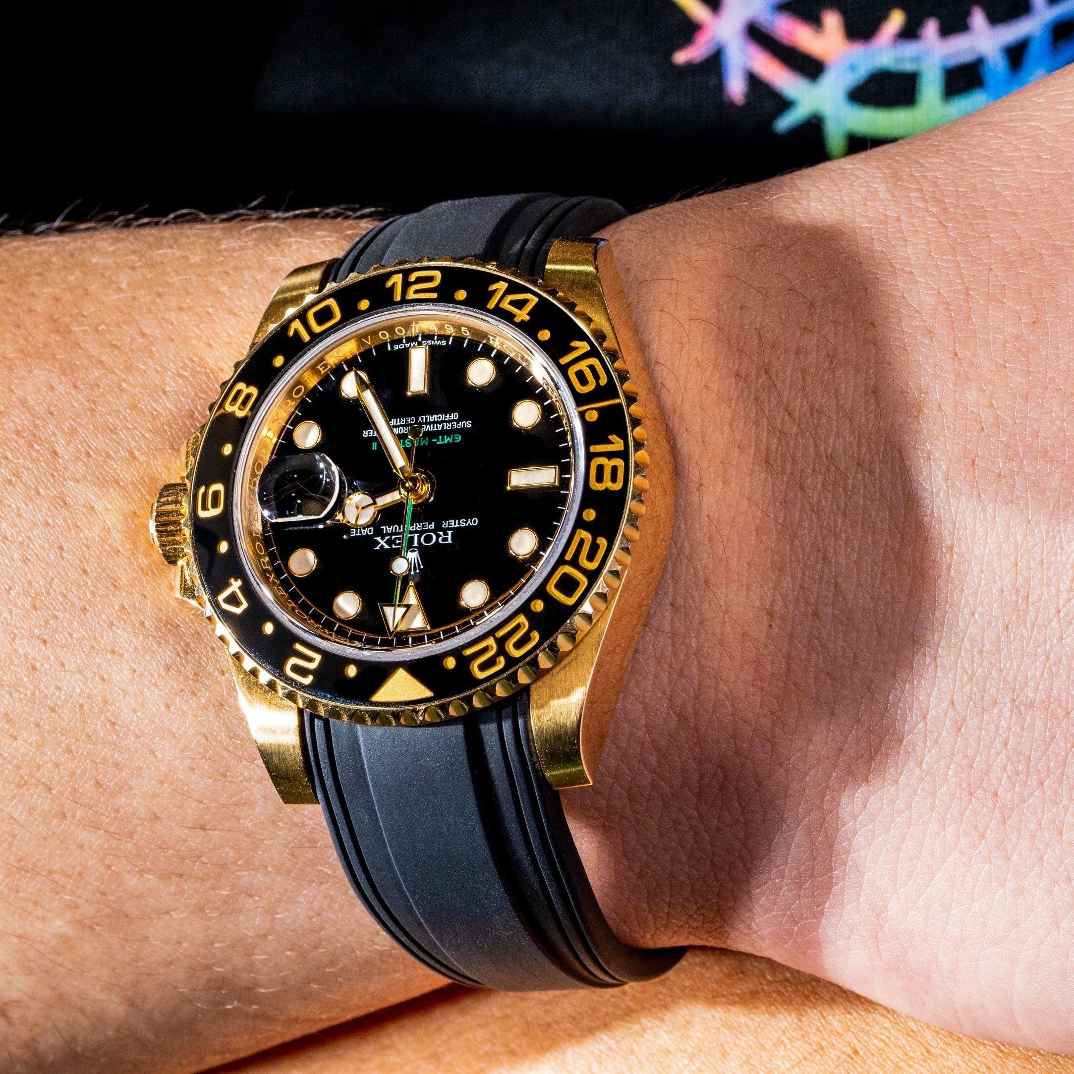 Gold rolex hotsell black strap