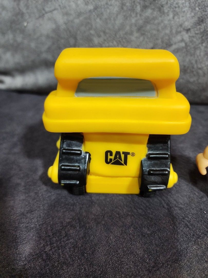 Caterpillar battery operated motorised construction toy vehicle with sound, light and motion