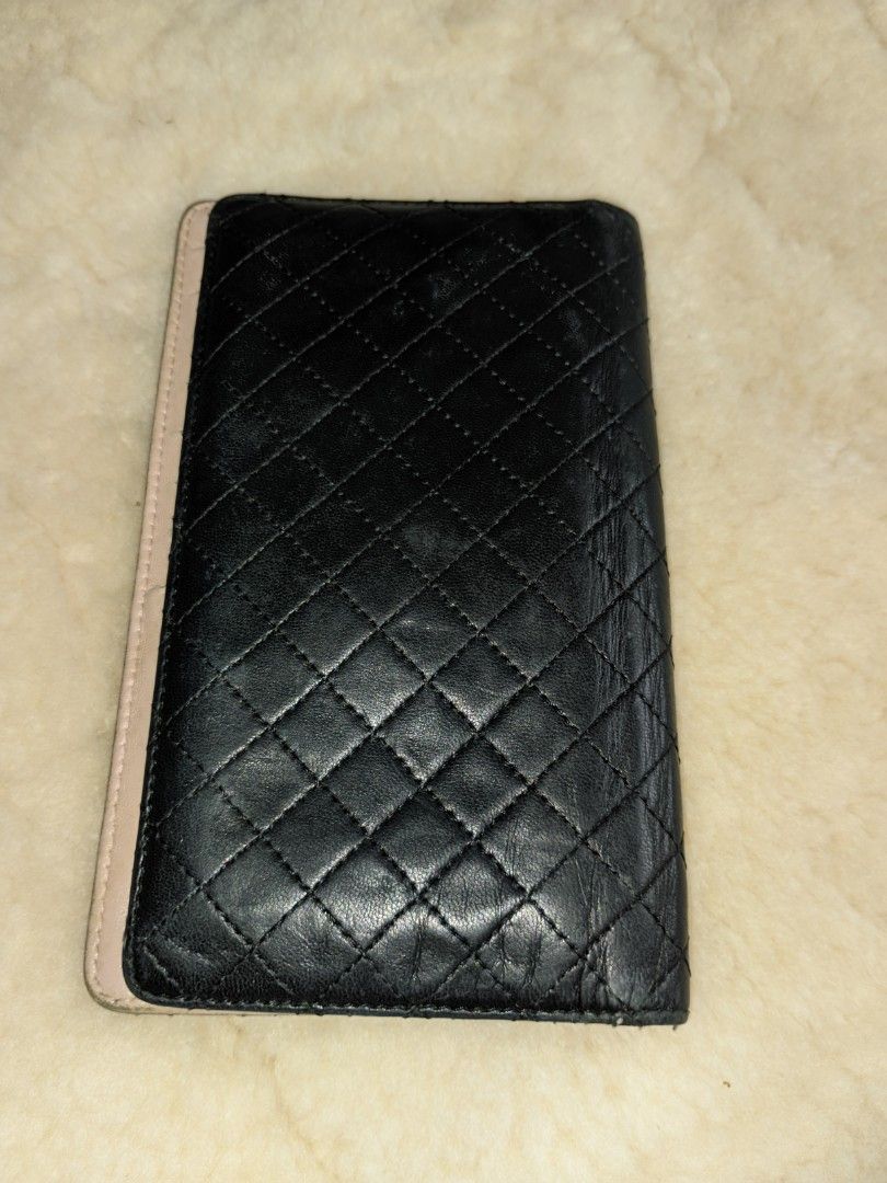 Aunthentic Chanel wallet (Category: Luxury Bags & Wallets) located in Bacoor. Submitted by nigel_008 (Listing ID 1239989817, Image 2). Description: Aunthentic chanel long wallet micro matelasse lambskin (bifold) color black, pink material leather size h 18cmx w10.5cmx d2cm condition good the item has been used and has minor flaws.