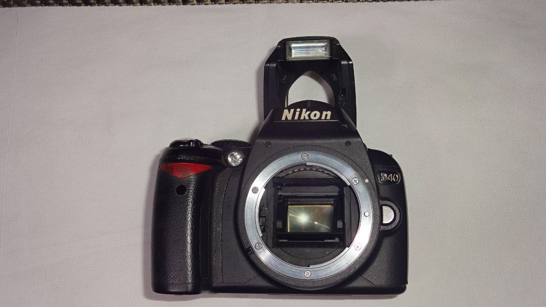 nikon D40 DSLR camera body only (Category: Cameras) located in Paranaque City. Submitted by kutoi.ancheta (Listing ID 1240030296, Image 1). Description: nikon D40 DSLR camera body only Nikon f mount Generic battery included ₱2000 condition: working condition before! Untested today! Buy at your own risk! No charger! No SD card! Lens compatibility is buyer's responsibility! cons / issues ✖️dust specks inside the focusing screen, ✖️viewfinder: usual