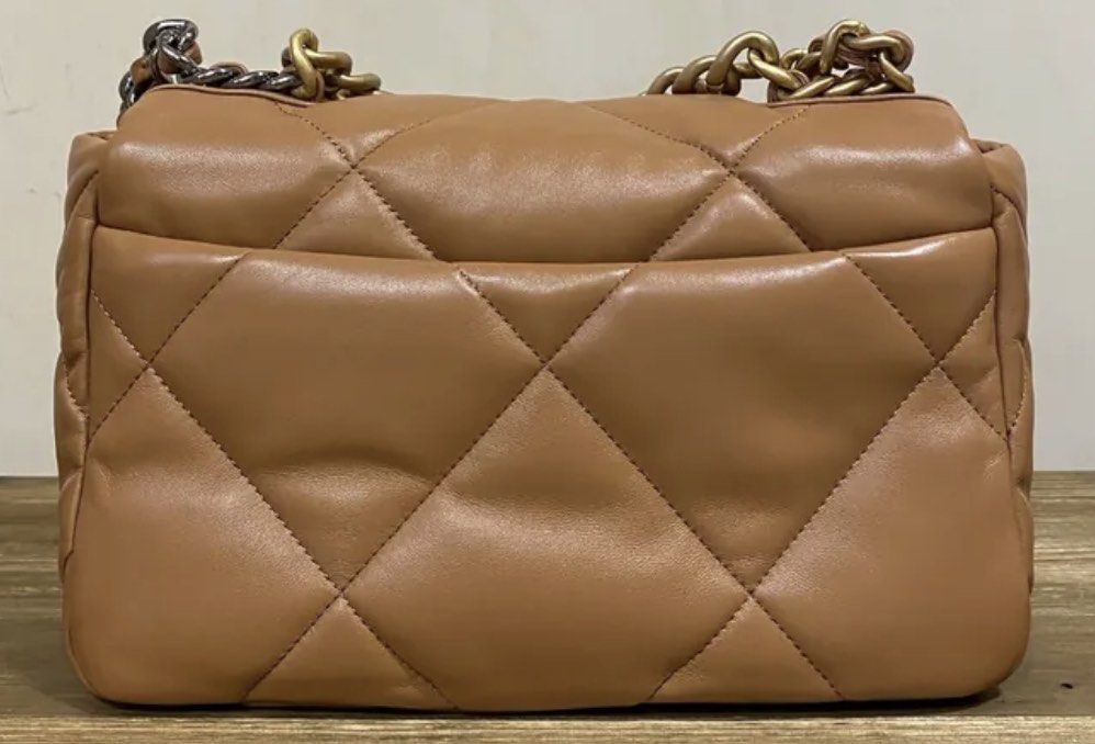 Chanel 19 Brown GHW Lambskin (Category: Luxury Bags & Wallets) located in Quezon City. Submitted by __12345 (Listing ID 1240168230, Image 2). Description: - for preorder - 9.5/10 condition - small, brown GHW, series no HCE - inclusions: dustbag, receipt, box - can do meet ups/delivery - guaranteed authentic or money back - detailed photos available upon request - entrupy available upon request open to other bag requests! just send a pm 💌🛍️.