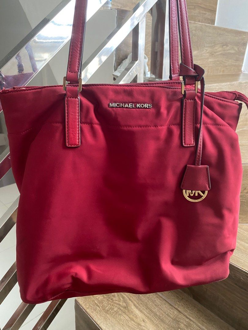 MK tote bag preloved (Category: Luxury Bags & Wallets) located in San Jose del Monte. Submitted by joysamarille (Listing ID 1240112855, Image 1). Description: Pre loved Michael Kors Tote Bag Guaranteed authentic (bought in US) material: nylon color: maroon #prelovedbags #authenticbags .