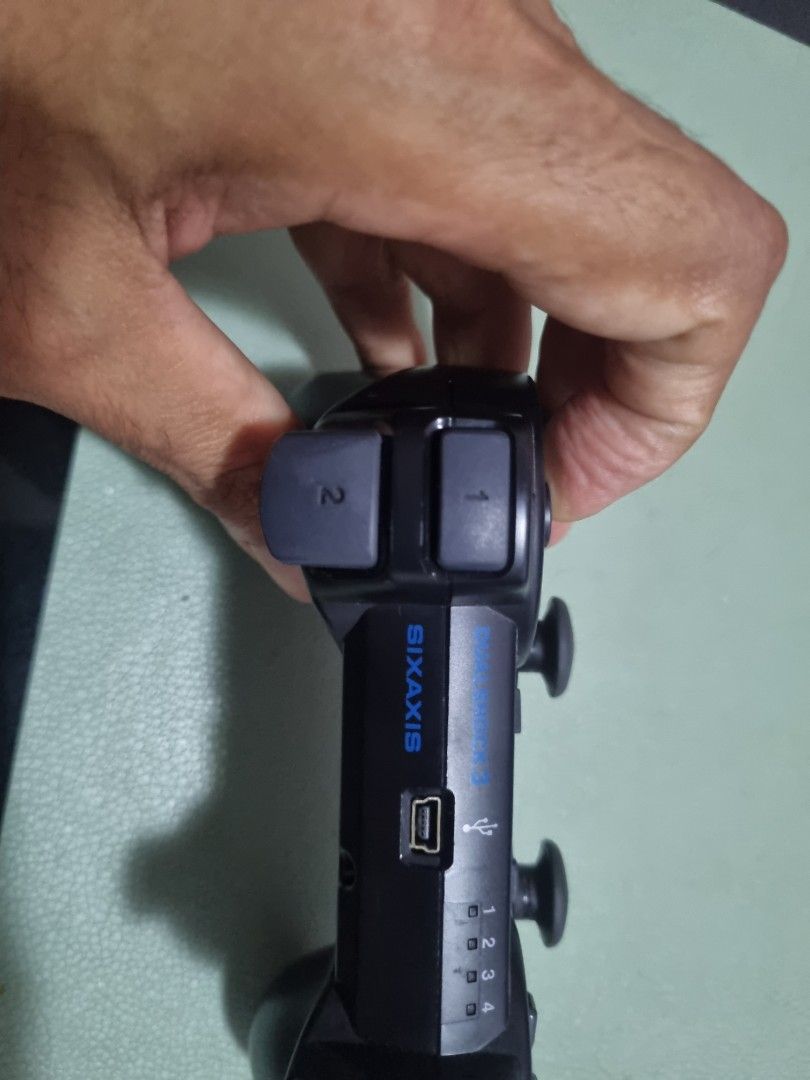 Playstation console controller (Category: PlayStation) located in Singapore. Submitted by cayotelives (Listing ID 1240118446, Image 3). Description: please check if this is what you need I not familiar anything with this thanks :).