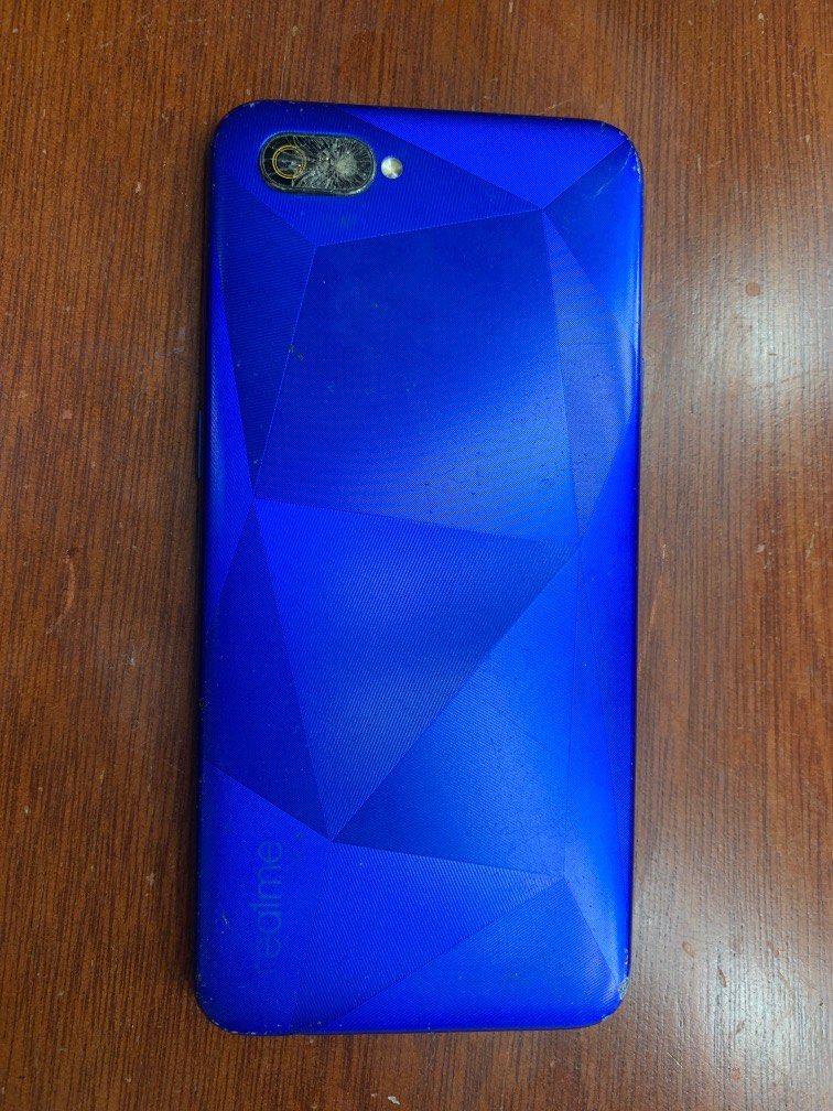 Realme C2 mobile phone (Category: Realme) located in Muntinlupa City. Submitted by Tins_preloved (Listing ID 1240220791, Image 1). Description: Honest issue: Broken LCD/Touchscreen and Camera Lens. (Pinaglaruan ng pamangkin ko na 2 years old).