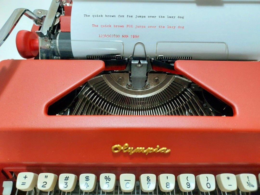Vintage Typewriter Olympia SM9 (Category: Office & Business Technology) located in Quezon City. Submitted by owlvintage (Listing ID 1240105423, Image 2). Description: Vintage Typewriter Olympia SM9 Made in Germany. Sold as is. Vintage & refurbished. custom painted in Matte Red and Gold on the logo. Payment by Gcash. Shipping costs shouldered by buyer. Pick up in Quezon City. Thank you..