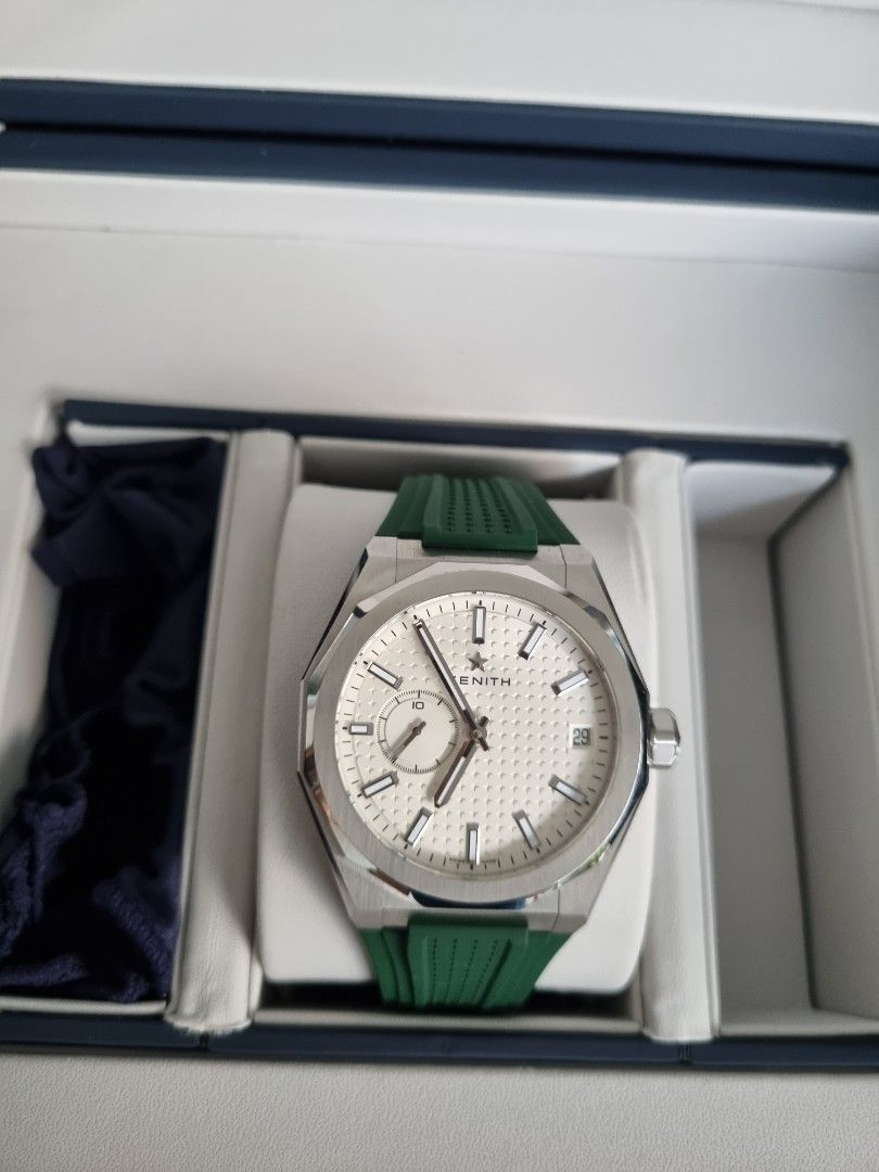 ZENITH (Category: Watches) located in Singapore. Submitted by finnette (Listing ID 1240193671, Image 3). Description: Zenith Defy Skyline 03.9300.3620 (March 2022) Automatic Watch with stainless steel bracelet (extra links) and green rubber strap Case 41mm No trades please..
