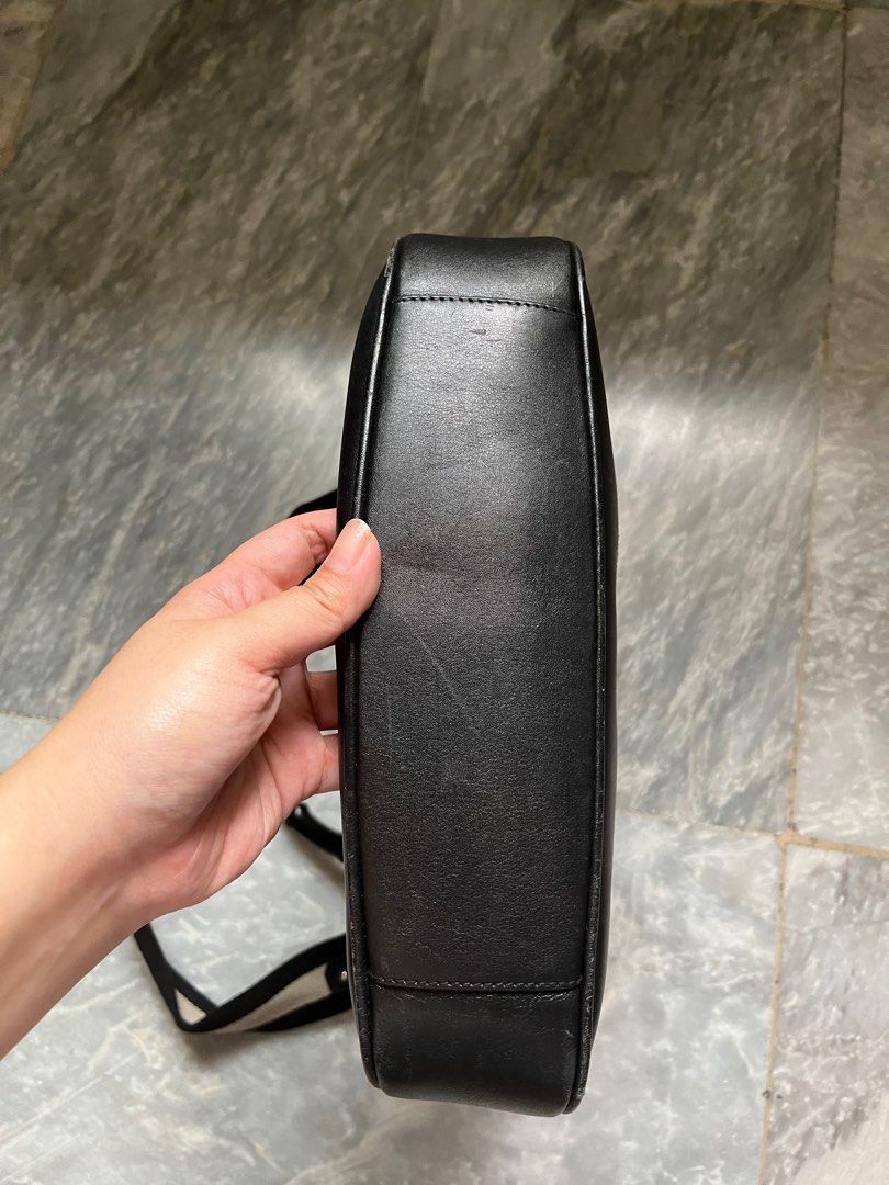 Authentic Black Gucci Bamboo Handle Bag (Category: Luxury Bags & Wallets) located in Paranaque City. Submitted by _lexus (Listing ID 1235412779, Image 3). Description: Well loved Gucci bamboo handle bag with strap. - Canvas material with leather bottom - Can be worn as a shoulder bag via bamboo handle or the strap - Silver hardware - Still very nice outside but lining inside is ripped Matches any outfit and is very low maintenance since its black