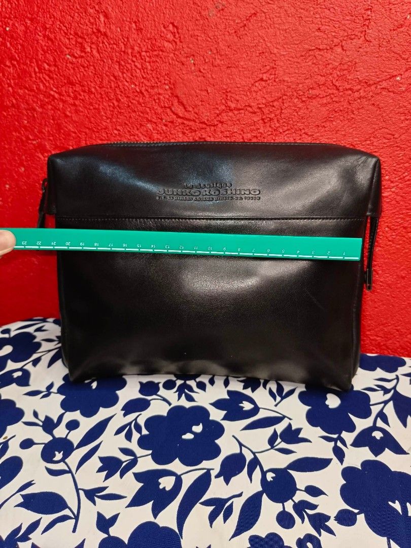 Junko Koshino Clutch Bag (Category: Luxury Bags & Wallets) located in Rizal. Submitted by roccini (Listing ID 1235382798, Image 2). Description: Junko Koshino Clutch Bag Authentic Moneyback Guaranteed in YKK Zip Black Genuine Leather Zipper closure with side compartment in zip closure as well With back slip in compartment Interior has lining. No tears on its lining Dimension is approximately 8.3"Length x 7"Height.