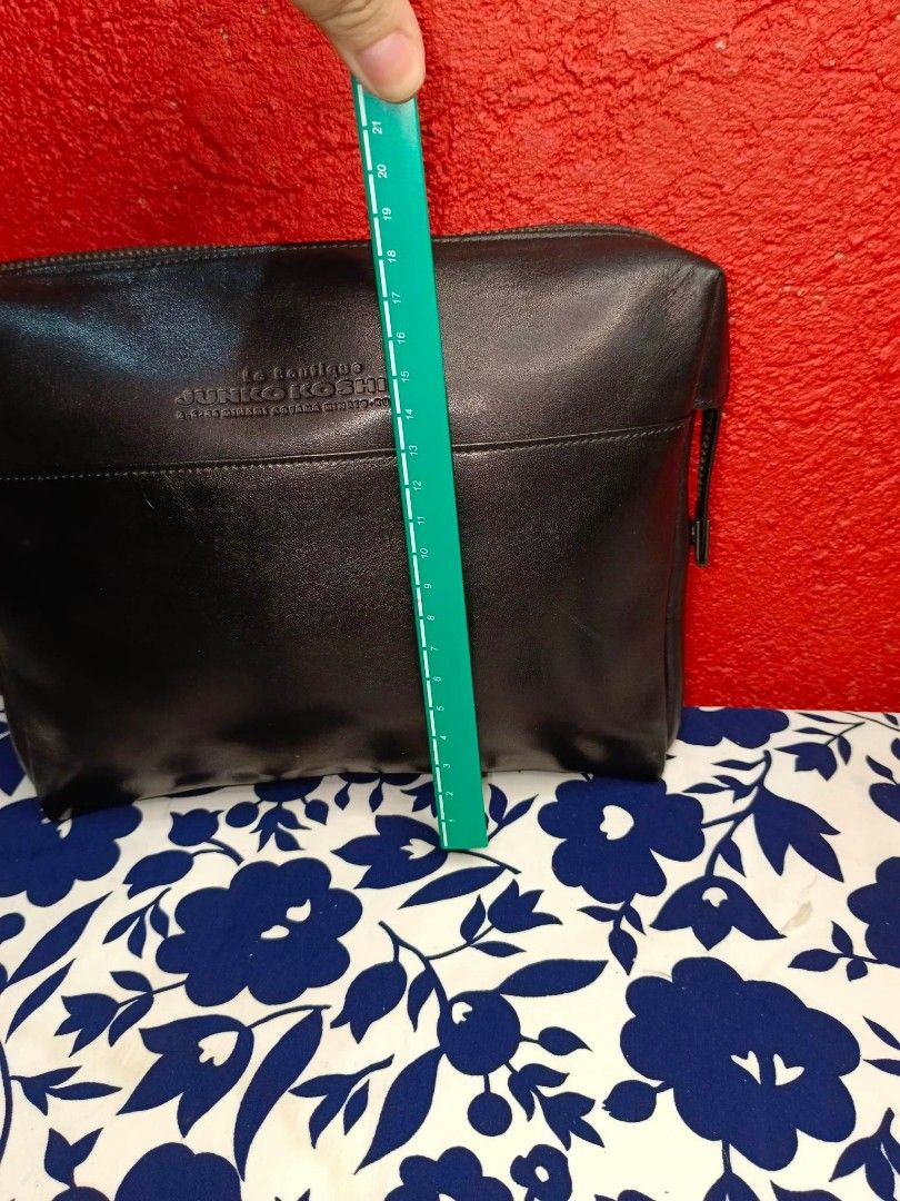 Junko Koshino Clutch Bag (Category: Luxury Bags & Wallets) located in Rizal. Submitted by roccini (Listing ID 1235382798, Image 3). Description: Junko Koshino Clutch Bag Authentic Moneyback Guaranteed in YKK Zip Black Genuine Leather Zipper closure with side compartment in zip closure as well With back slip in compartment Interior has lining. No tears on its lining Dimension is approximately 8.3"Length x 7"Height.