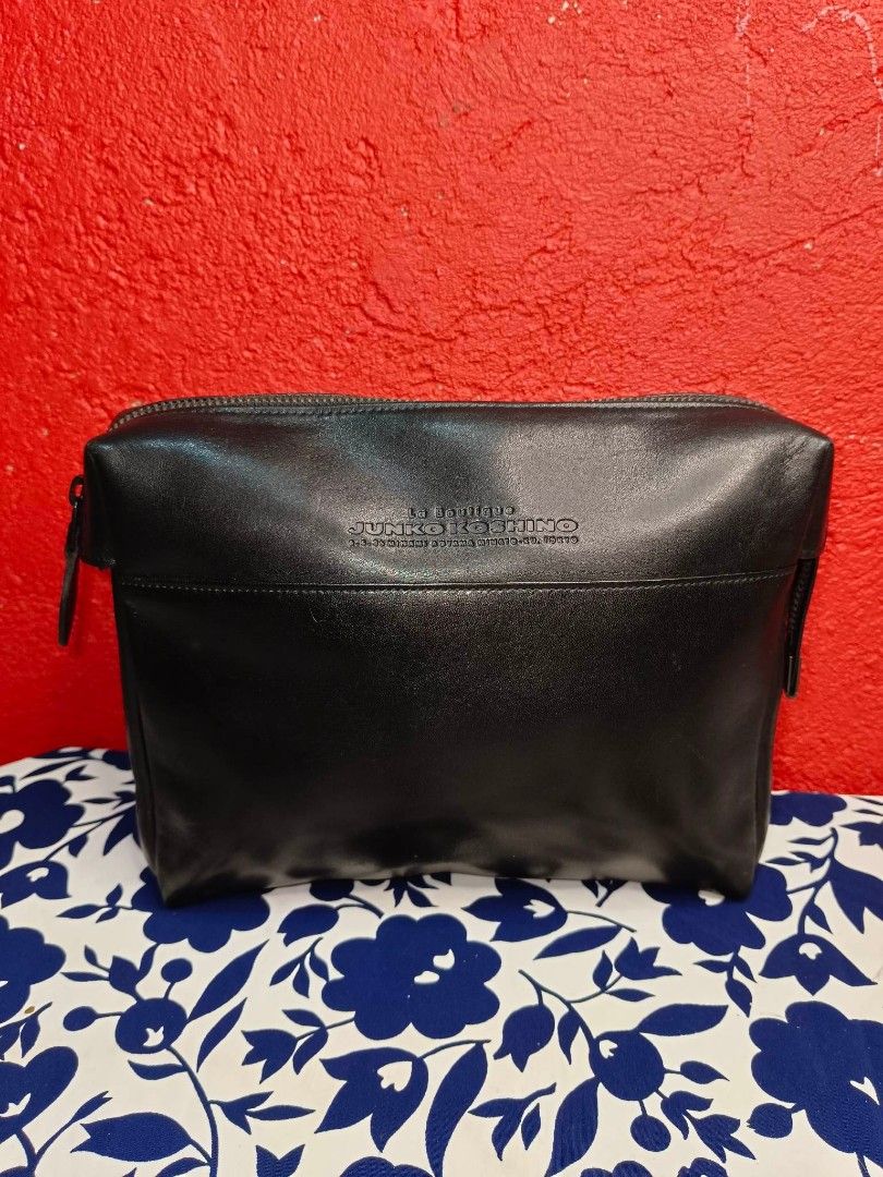 Junko Koshino Clutch Bag (Category: Luxury Bags & Wallets) located in Rizal. Submitted by roccini (Listing ID 1235382798, Image 1). Description: Junko Koshino Clutch Bag Authentic Moneyback Guaranteed in YKK Zip Black Genuine Leather Zipper closure with side compartment in zip closure as well With back slip in compartment Interior has lining. No tears on its lining Dimension is approximately 8.3"Length x 7"Height.