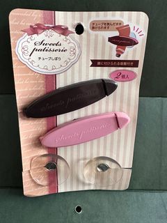 Toothpaste holder/squeezer